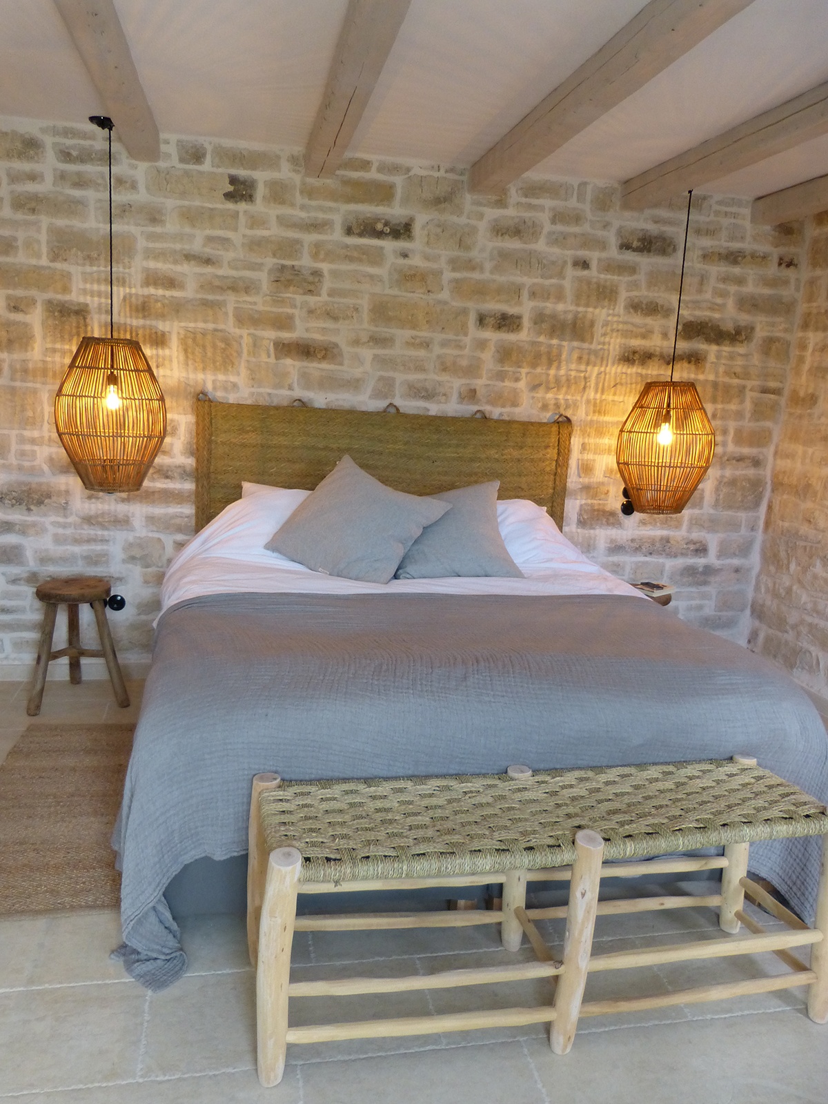 Patroclus rental home in Paxos, Greece. The home is decorated with rattan lamps and bamboo furniture.