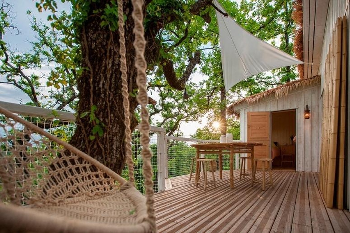 tree top houses in Toulouse, France decorated with bamboo furniture