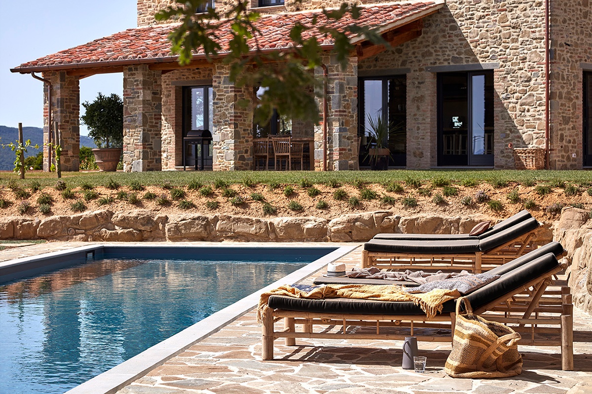 Il Nido rental home decorated with modern design and bamboo sunbeds by the pool